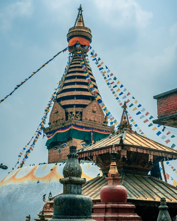 The Swayambhunath Stupa, a historic landmark in Kathmandu, Nepal, adorned with colorful prayer flags.